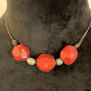 5/$25 necklace with chunky red beads and silver beads on leather string.